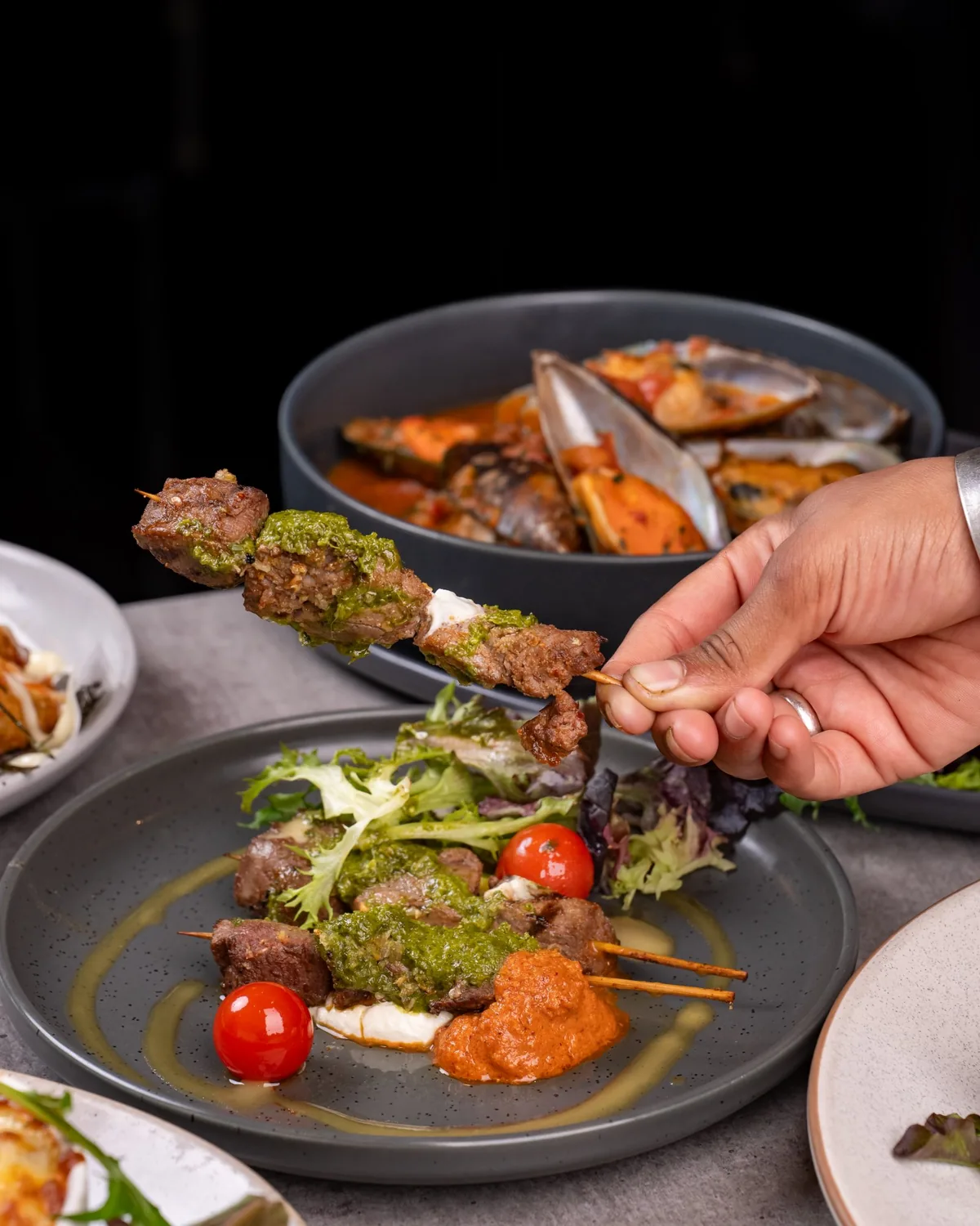 Chef plating a dish at Sage Yellowfin South Bank